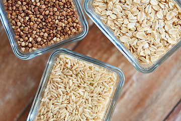 Image showing close up of grain in glass bowls on wooden table