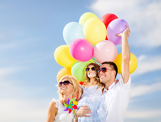 Image showing family with colorful balloons