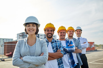 Image showing happy builders and architect at construction site