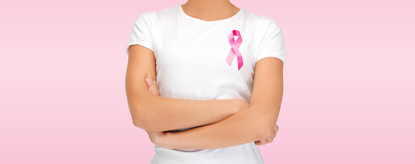 Image showing smiling woman with pink cancer awareness ribbon