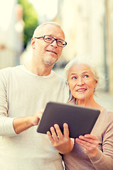 Image showing senior couple photographing on city street