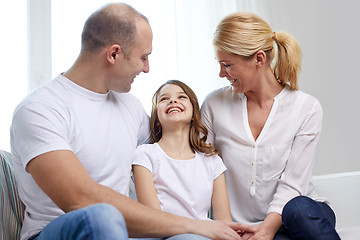 Image showing happy parents with little daughter at home