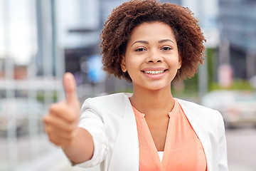 Image showing happy young african american businesswoman in city