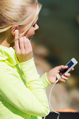 Image showing woman listening to music outdoors