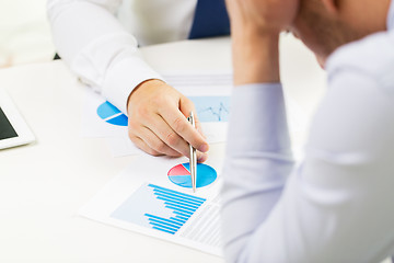 Image showing close up of businessman hands with chart