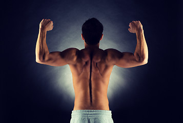 Image showing young male bodybuilder from back