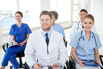 Image showing group of happy doctors on seminar at hospital