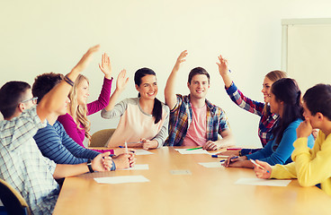 Image showing group of smiling students voting