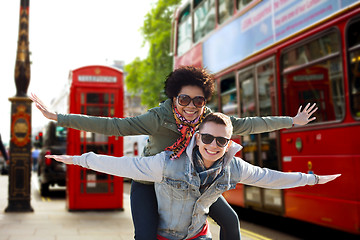 Image showing happy teenage couple having fun in london city