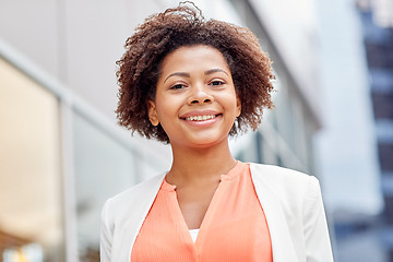 Image showing happy young african american businesswoman in city