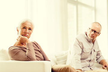 Image showing senior couple sitting on sofa at home