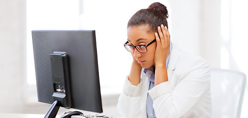 Image showing stressed african woman with computer