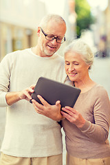 Image showing senior couple photographing on city street