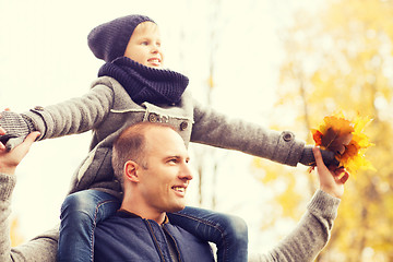 Image showing happy family having fun in autumn park