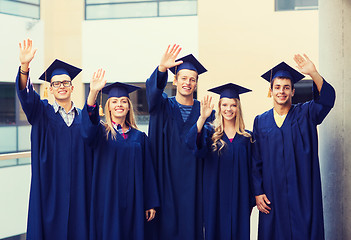 Image showing group of smiling students in mortarboards