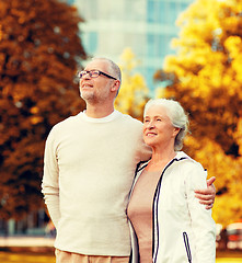 Image showing senior couple hugging in city park