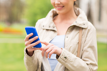 Image showing close up of woman calling on smartphone in park