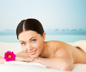 Image showing happy beautiful woman lying in spa