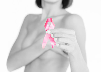 Image showing hand holding pink breast cancer awareness ribbon