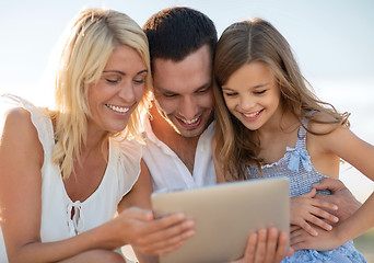 Image showing happy family with tablet pc taking picture