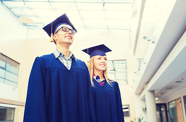 Image showing group of smiling students in mortarboards