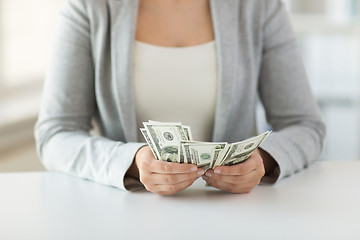 Image showing close up of woman hands counting us dollar money