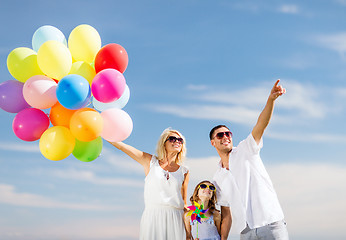 Image showing family with colorful balloons