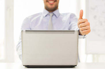 Image showing close up of businessman hands with laptop
