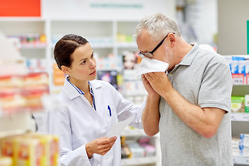 Image showing pharmacist and senior man with flu at pharmacy