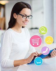 Image showing smiling woman with tablet pc shopping online