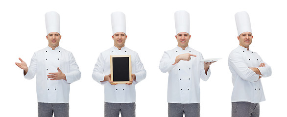 Image showing happy male chef cook holding blank menu board