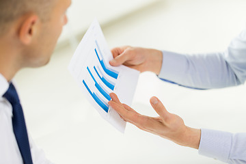 Image showing close up of businessman hands with chart