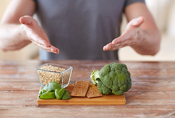 Image showing close up of male hands showing food rich in fiber