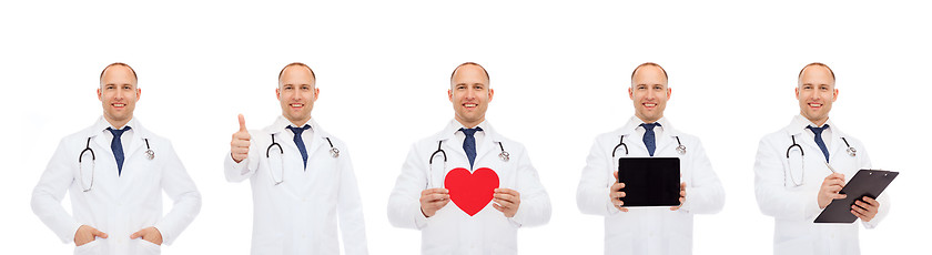 Image showing doctors with red heart, tablet pc and clipboard