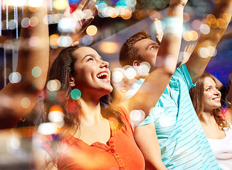 Image showing smiling friends at concert in club