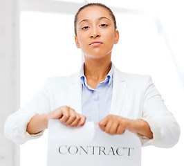 Image showing african businesswoman tearing contract