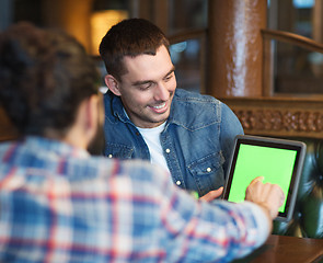 Image showing male friends with tablet pc at bar