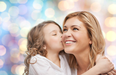 Image showing happy mother with daughter hugging and kissing