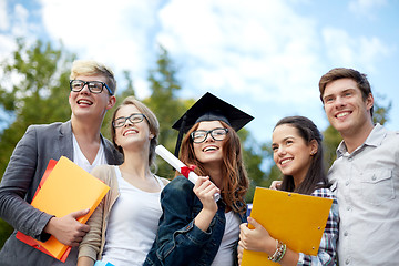 Image showing group of smiling students with diploma and folders