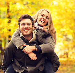 Image showing smiling couple having fun in autumn park