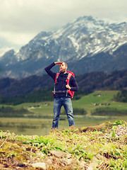 Image showing tourist with beard and backpack looking far away