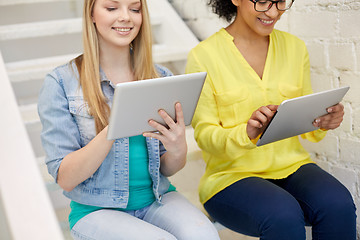 Image showing close up of students with tablet pc at school