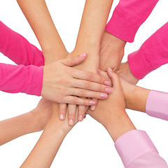 Image showing close up of women with hands on top