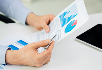 Image showing close up of businessman hands with charts