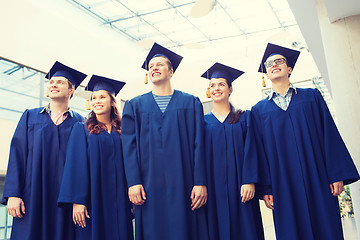 Image showing group of smiling students in mortarboards