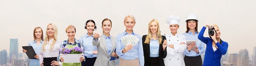 Image showing woman holding money over professional workers