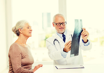 Image showing smiling senior woman and doctor meeting