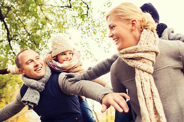 Image showing happy family having fun in autumn park