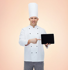 Image showing happy male chef cook showing with tablet pc