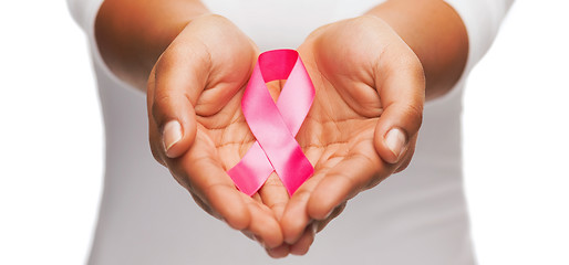 Image showing hands holding pink breast cancer awareness ribbon